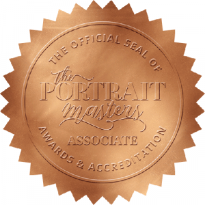 Graphic Image of a foil seal that is copper colored, It reads "official seal of Portrait Mastery"