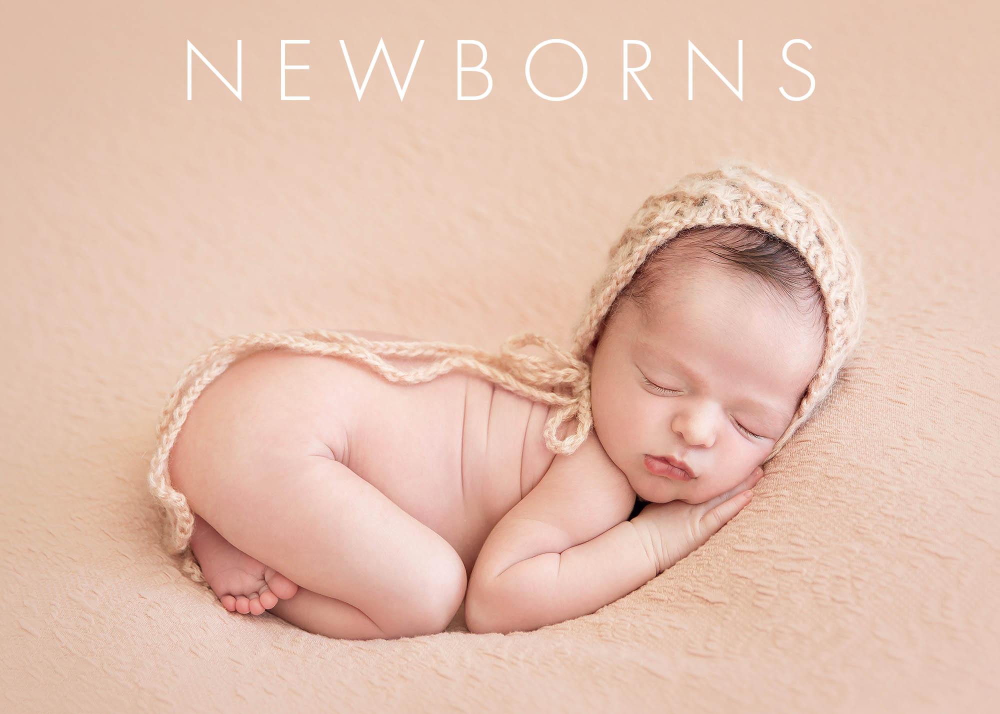 Newborn Photographer, a baby sleeps with a knit bonnet