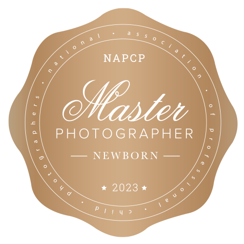 Featured Award Badge, A gold Seal reads "NAPCP Master Photographer  [for] Newborn 2023"