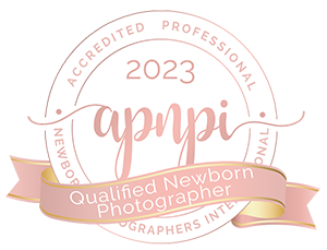 Featured Award Badge, A gold Seal reads "APNPI Qualified Newborn Photographer 2023"